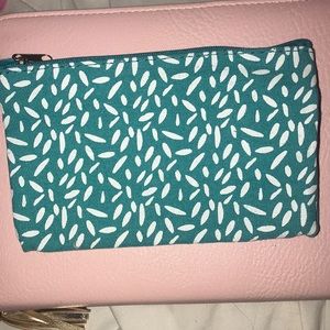 Mini makeup bag.